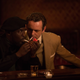 Rock (Michael Kenneth Williams) shares a match with a stranger (Michael Sheen) (Katrina Marcinowski/IFC)